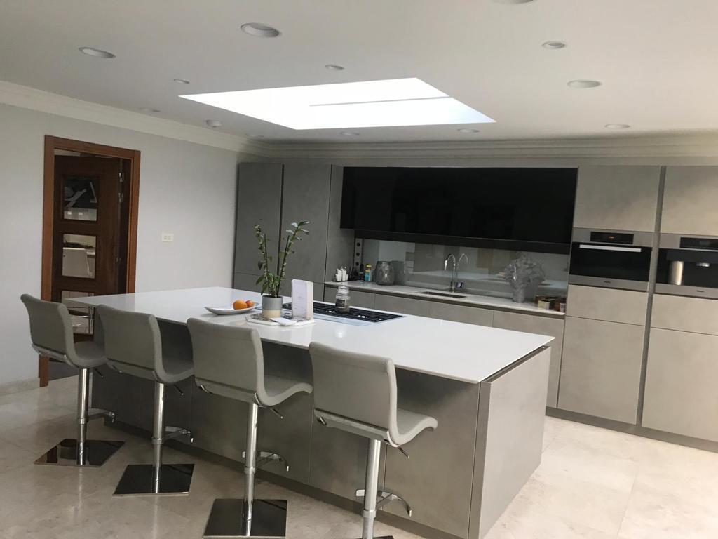 Bespoke kitchen installation with island and roof lantern